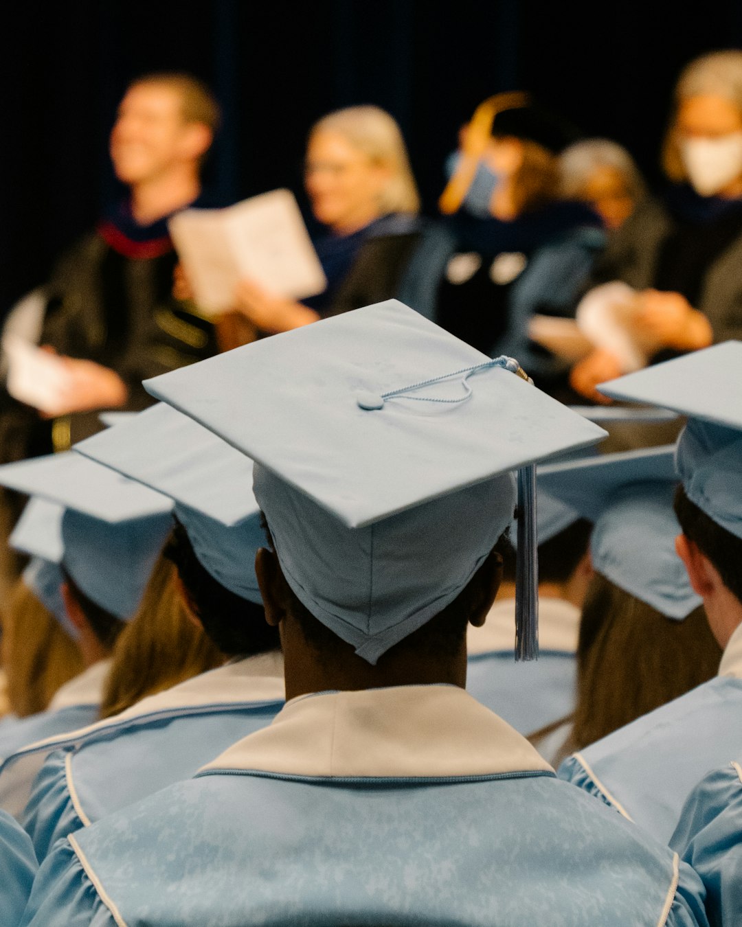 Graduates in caps and gowns at commencement — representing the graduate attributes that define engineering program outcomes