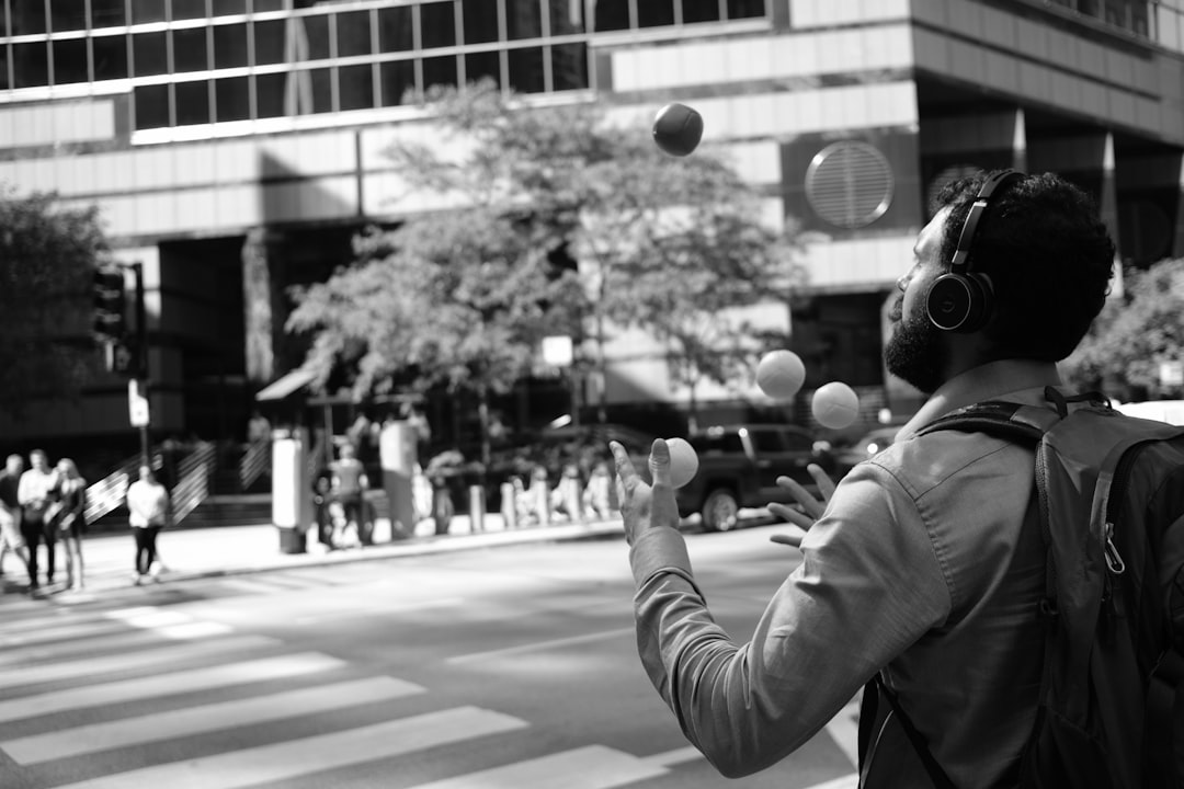Person juggling balls — representing the challenge of managing multiple accreditation cycles simultaneously