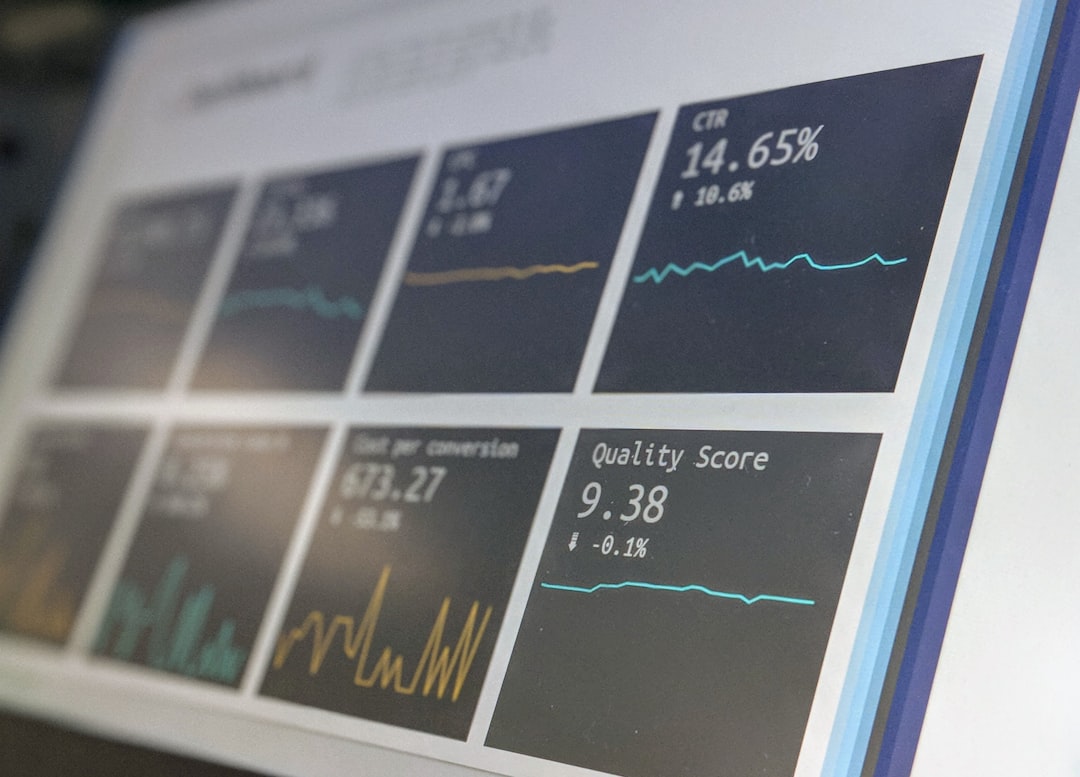 Data reporting dashboard on a laptop screen — representing ongoing assessment data tracking between accreditation cycles