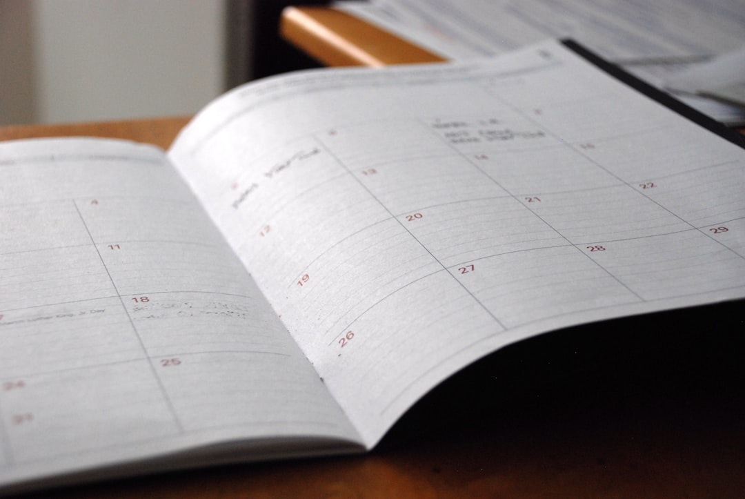 Calendar with red push buttons pinned to it