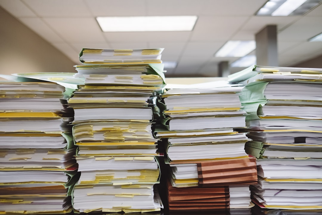 Stacks of paper documents and file folders