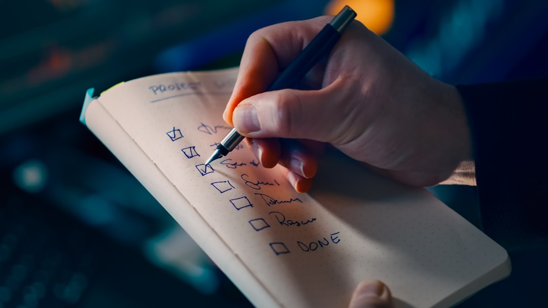 Hand checking off items on a to-do list