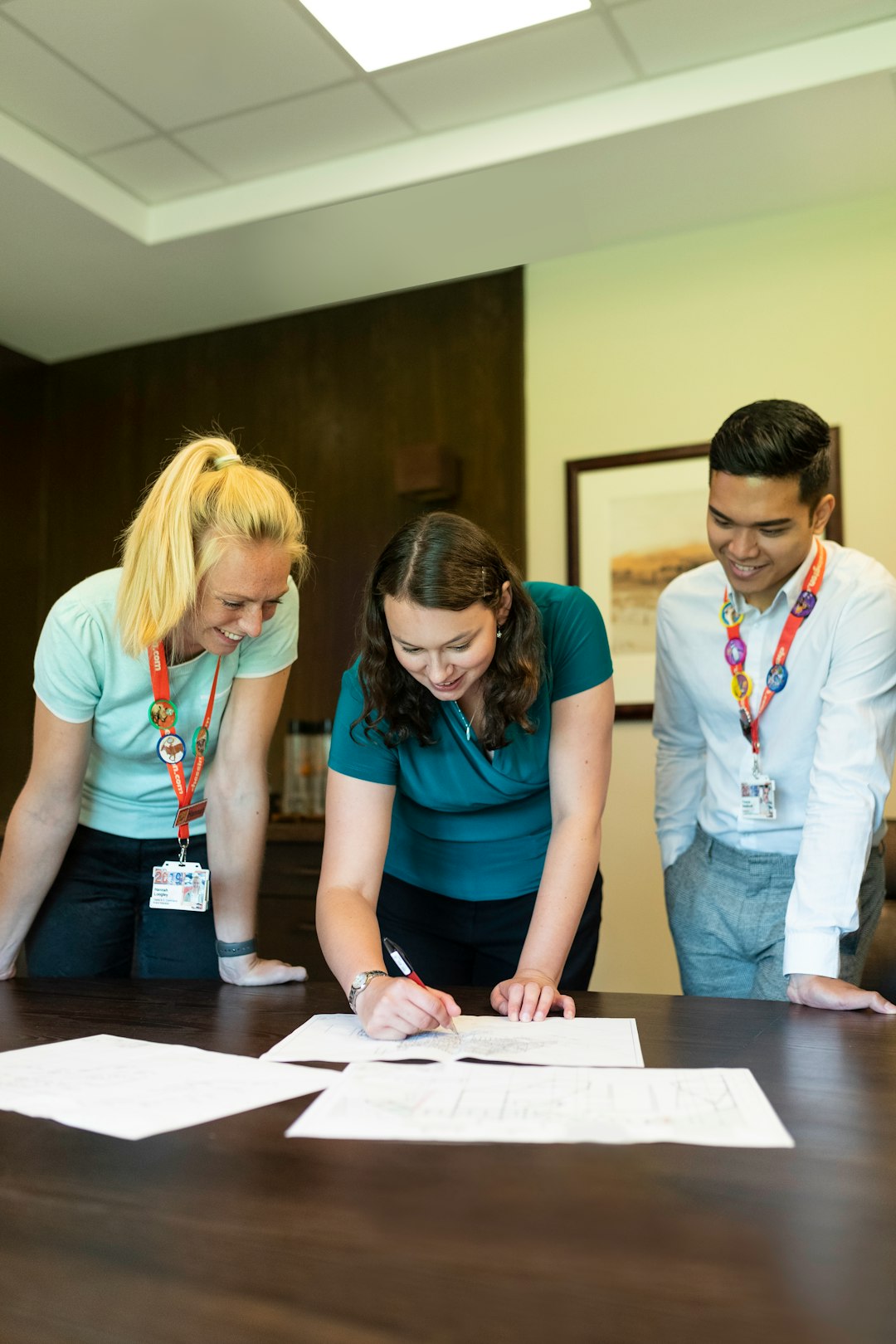 Female engineers collaborating with colleagues — representing the faculty-coordinator communication dynamic in evidence collection