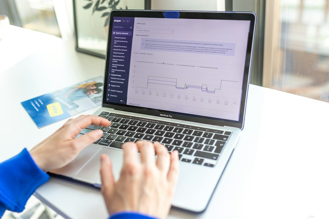 Hands typing on a laptop, navigating the Tandem submission interface