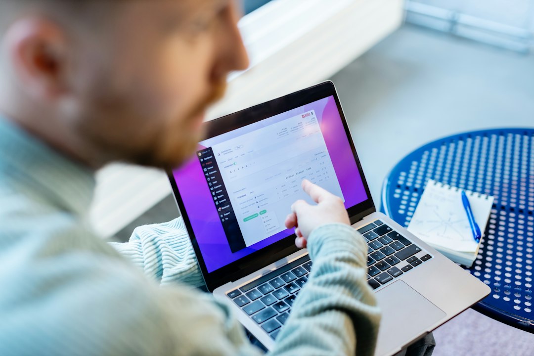 Professional using a tablet to review accreditation data