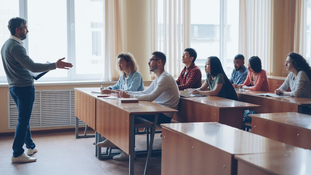 A professor teaching a lecture to students, the teaching context in which course evidence is generated