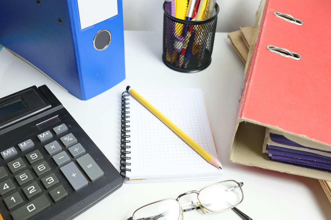 Blue and pink binders with notebook and pencil — starting evidence collection for the next visit