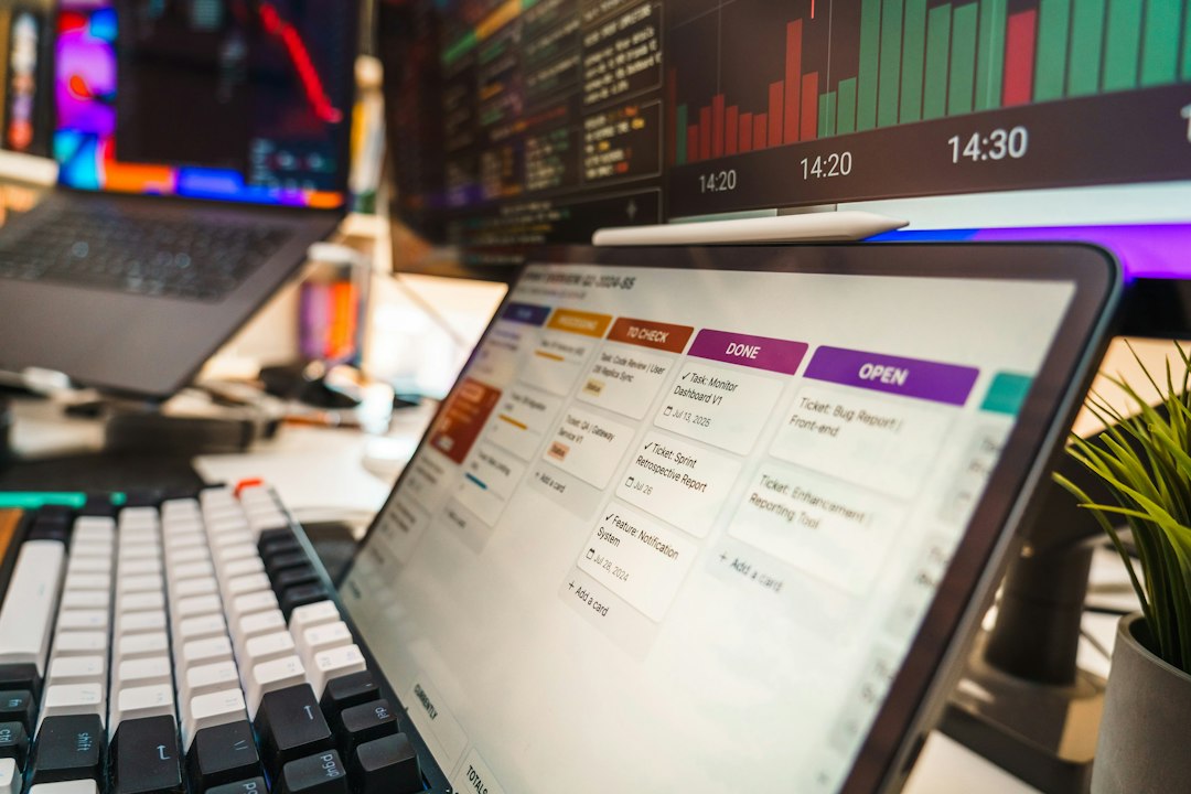 A tablet showing a project tracking board with status columns, representing the migration to connected records